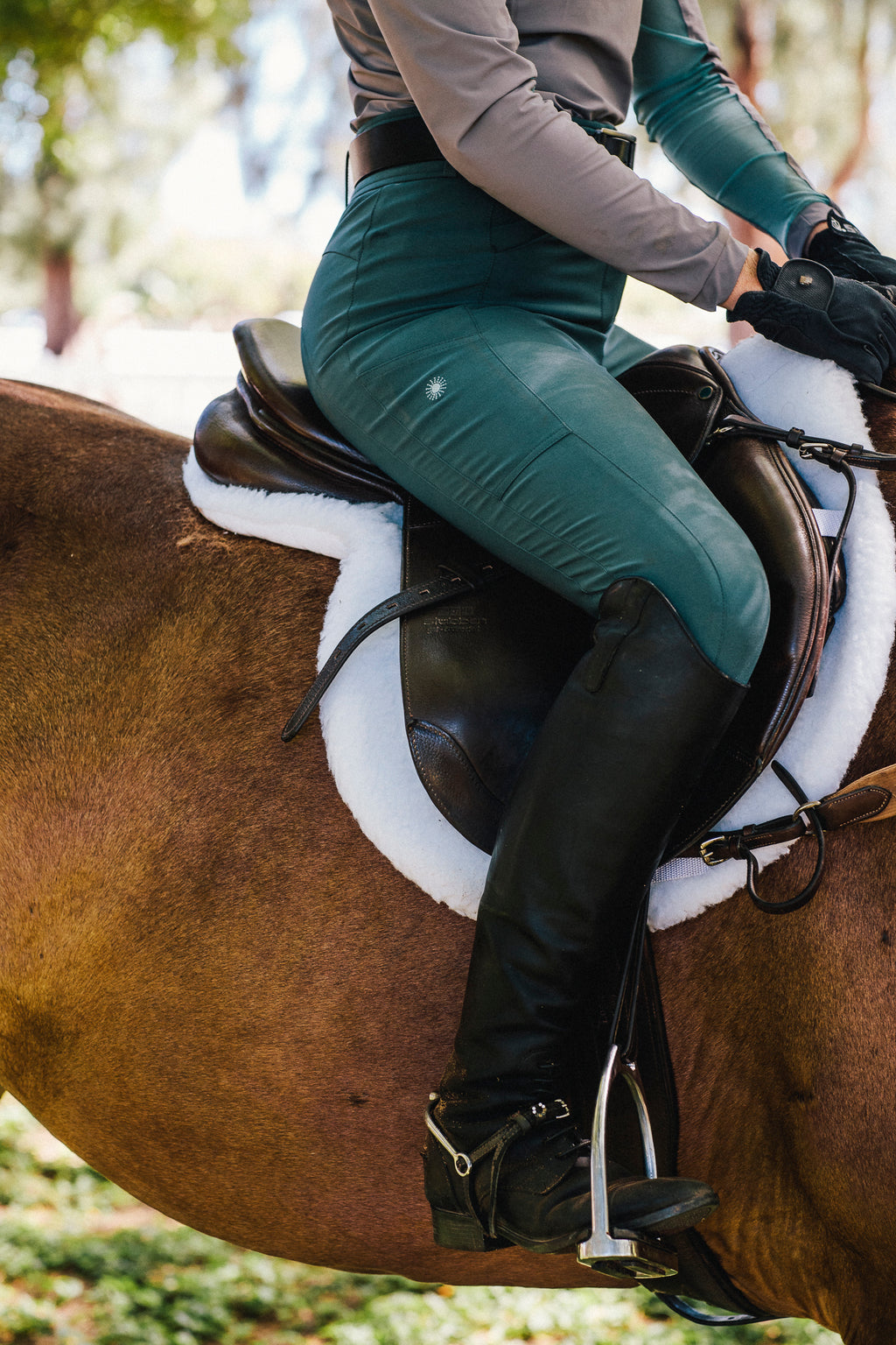 Breeches with knee patches in a dark teal color